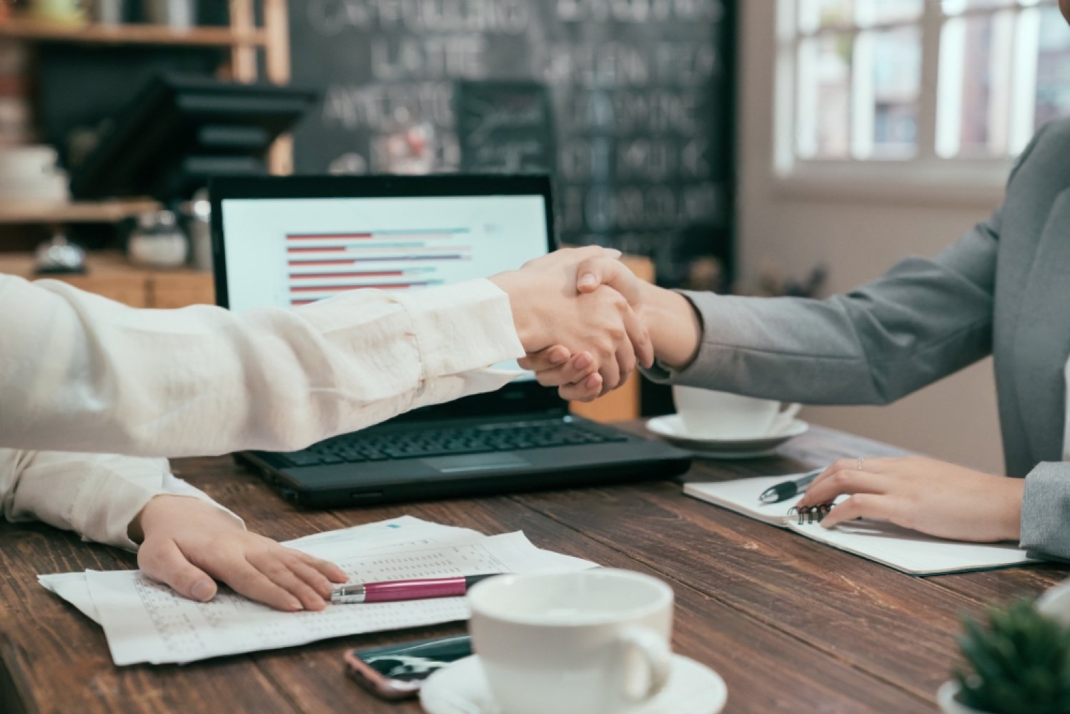 stock-photo-close-up-shot-of-unrecognizable-business-partners-women-shaking-hands-as-sign-of-successful-1380979181